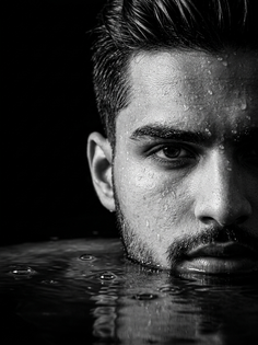 Dramatic Black and White Face Emerging from Water