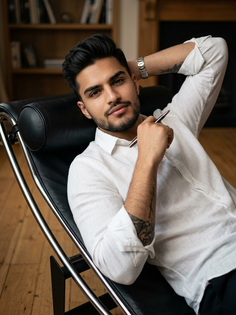 Cinematic Recliner Portrait with White Linen Shirt