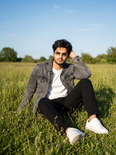 Young Man Grassy Field Outdoor Portrait