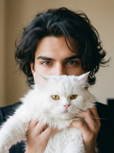 Young Man with White Persian Cat Portrait